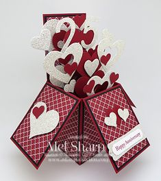 an origami valentine's day card with hearts