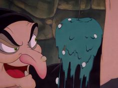 an animated image of a cartoon character with green stuff on his face and tongue out