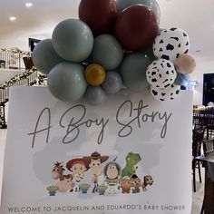 there is a sign that says a boy story with balloons attached to the back of it