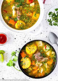 a bowl of soup with meat and vegetables