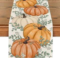 a table runner with pumpkins on it