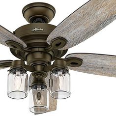 a ceiling fan with three lights on it and the words crown canyon 52 in indoor regal bronze ceiling fan