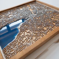 a wooden frame with a cut out map on it