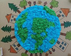 the earth made out of tissue paper on top of a table