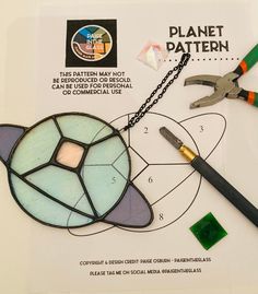 a piece of paper that has some scissors and other items on it with the words planet pattern