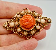 "Pink Brooch, Pink Pendant, Angel Skin Coral Brooch, Pink Coral Pendant, & Red Coral, Sea Coral, Cultured Pearls, Rose Pendant, Rose Brooch, Floral Pendant, Floral Brooch, Convertible Brooch/ Pendant, 14K Gold. This gorgeous vintage Brooch is finely crafted in solid 14K Yellow gold (stamped and also carefully tested and guaranteed). The center beautiful carved coral flower measures 16mm. It is complimented with ten Angel skin pearls of 3mm and two corals of 4mm. Two 2mm each cultured pearls Elegant Rose Design Brooch, Rose Colored Wedding Brooch Jewelry, Elegant Formal Brooch With Rose Design, Elegant Rosette Brooches As A Gift, Elegant Formal Rose Design Brooch, Elegant Formal Rose Design Brooches, Vintage Rose Jewelry With Brooch, Vintage Rose Brooch Jewelry, Vintage Rose Gold Brooches For Wedding