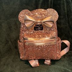 Fabric Type: Sequin Measurements: 10 1/2" H 9" W X 4 1/2" D Material: 60% Pet / 40% Pu Features: Sequin Outer Shell With 2 Way Top Zipper Closure. Fully Lined Interior Front Zipper Pocket. Adjustable Shoulder Straps. Top Carry Handle. 100% Authentic; Parks Exclusive Never Used Condition. Smoke/Pet Free Home! Cute Gold Bags For Everyday Use, Cute Gold Bag, Cheap Pink Disney Backpack, Sequin Loungefly, Tinkerbell Loungefly, Disney Princess Loungefly Backpack, Disney Loungefly Backpack Star Wars, Sequin Backpack, 2 Way