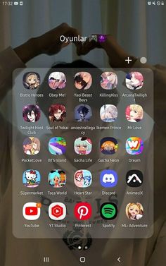 a person holding their head in front of the screen with many different icons on it