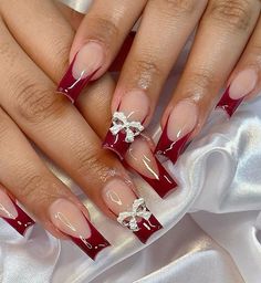 Red Nail Inspo Christmas, Hoco Nails To Match A Red Dress, Red French Tip Acrylic Nails With Rhinestones, White And Dark Red Nails, Red Nails Acrylic Homecoming, Red Nail Set Prom, Red Christmas Nails French Tip, Red Nails For Graduation, Red French Tip Nails With Pearls