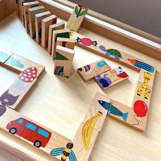 wooden toys are arranged in the shape of letters