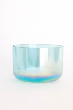 a glass bowl sitting on top of a white table