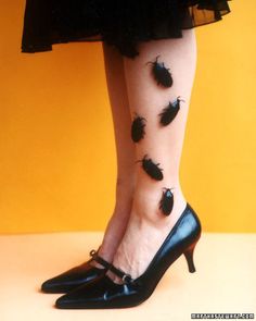 a woman's foot with black flowers on it