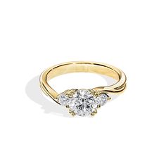 a yellow gold engagement ring with two diamonds