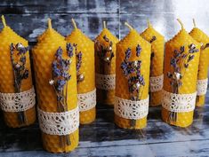 bees and lavenders are wrapped in burlock to look like candles for wedding decor