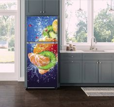 a refrigerator covered in fruit sitting next to a window