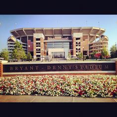 the entrance to bryant - denny stadium in denver, colorado with flowers on the side