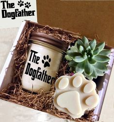 the dogfather candle and soap gift set in a box with succulents