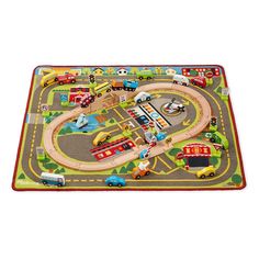 a child's play mat with cars and trucks on the road in front of it