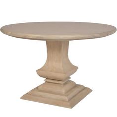 a round wooden table with two pedestals on each side