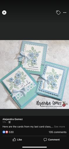 three cards with blue flowers on them, one has a bow and the other has an envelope