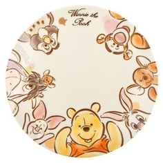 the winnie the pooh plate is decorated with cartoon characters