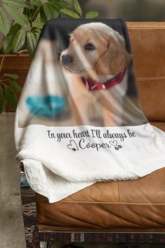 a dog is sitting on top of a couch with a blanket that says, in your heart i'll always be cooper