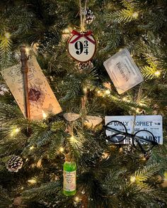 a christmas tree decorated with books and ornaments