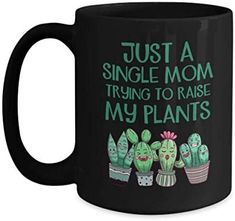 a black coffee mug that says, just a single mom trying to raise my plants