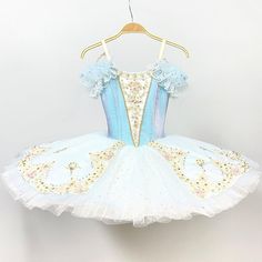 New creation 2023! This awesome stage costume has been created for roles such as Cinderella in Act III or for the ballet Sylvia. The bodice is made with blue satin fabric, and features a big V cut in the front, and a white insert with rich decorations, such as appliques and crystals. The pale blue arm bands are also decorated with sparkles and lace. The slightly bell shaped tutu skirt is white, with a pale blue overlay, and features very rich decoration with appliques, beads and crystals. Custom Cinderella Ballet Costume, Cinderella Ballet, Dream Daughter, Blue Satin Fabric, Blue Overlay, Pancake Tutu, Classical Ballet Tutu, Ballet Photos, New Creation