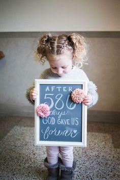 Adoption photography - young girl holding a sign about being adopted Adoption Celebration Ideas, Adoption Finalization Party, Volunteer Photography, Adoption Party Ideas, Nancy Dow