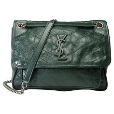 Saint​ ​Laurent​ ​Niki​ ​medium​ ​model​ ​shoulder​ ​flap​ ​bag​ ​in​ ​green​ ​crinkled​ ​leather,​ ​aged​ ​silver​ ​metal​ ​trim,​ ​a​ ​transformable​ ​chain​ ​handle​ ​in​ ​aged​ ​silver​ ​metal​ ​allowing​ ​a​ ​shoulder​ ​or​ ​crossbody​ ​carry Closure​ ​by​ ​YSL clasp​ ​in​ ​metal​ ​green Black​ ​canvas​ ​lining,​ ​one​ ​patch​ ​pocket,​ ​one​ ​zip​ ​pocket Signature:​ ​"Saint​ ​Laurent​ ​Paris​ ​Made​ ​in​ ​Italy" Dimensions:​ ​28x20x9​ ​cm​ ​(11x7.9x3.5​ ​Inches) Shoulder​ ​strap​ ​length:​ ​55​ ​cm​ ​(21.7​ ​inches) Reference:​ ​102024 General​ ​condition:​ ​7/10 In​ ​very​ ​good​ ​condition​ ​despite​ ​wear​ ​marks​ ​on​ ​the​ ​leather​ ​(scratches,​ ​wear​ ​at​ ​corners),​ ​interior​ ​canvas​ ​(dirt)​ ​and​ ​trim​ ​(scratches,​ ​slightly​ ​worn​ ​YSL​ ​clasp​ ​logo) Ysl Niki Medium, Model Shoulder, Saint Laurent Paris, Metal Trim, Black Canvas, Green Bag, Flap Bag, Fashion Handbags, Patch Pocket