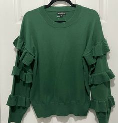 J Crew Mercantile Women Green Wool-Blend Ruffle Sleeves Pullover Sweater Size Medium . Condition is "New with tags". Shipped with USPS Priority Mail. A classic sweater + ruffly sleeves = how to have fun getting dressed. - Length 25" - Crewneck - Long sleeves - Rib trim at neck, cuffs and hem. Fiber Content: 50% Wool, 30% Acrylic, 20% Nylon Care: Dry Clean Chic Long Sleeve Sweater With Ruffles, Chic Sweater With Ruffles For Layering, Chic Ruffled Sweater For Layering, Long Sleeve Sweater With Ruffles For Fall, Crew Neck Ruffle Sweater For Layering, Chic Stretch Sweater With Ruffles, Green Ruffle Sleeve Tops For Fall, Spring Crew Neck Sweater With Ruffles, Crew Neck Sweater With Ruffles For Spring