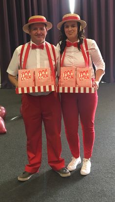 two people dressed in red and white standing next to each other