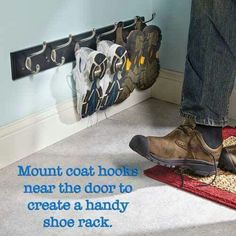 a person standing on the floor with their feet up in front of a shoe rack