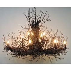 Handcrafted from reclaimed hickory branches and twigs, this oversized 14 light twig chandelier adds the perfect amount of "green" and rustic charm for large, open spaces. In addition to being so naturally stylish, this chandelier is superior to most natural twig fixtures due to the fact that hickory bark will not shed as it dries. Sizes will vary slightly. Bamboo Art Diy, Twig Chandelier, Decoupage Pumpkins, Chic Halloween Decor, Twig Lights, Boho Halloween, Boho Wreath, Holiday Decor Halloween, Branch Chandelier