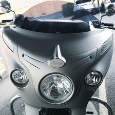 the front view of a motorcycle parked on the street