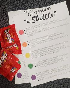 a candy bar sitting on top of a table next to a piece of paper