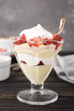 the best dairy - free vanilla pudding in a glass dish with strawberries on top