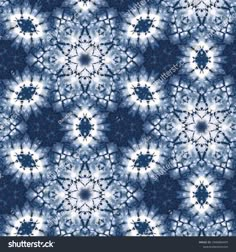 abstract blue and white tie dye background with circular shapes in the center, as well as an