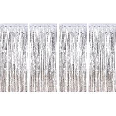 three silver foil curtains hanging on the wall in front of a white backdrop with fringes