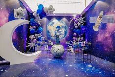 a space themed party with balloons and decorations