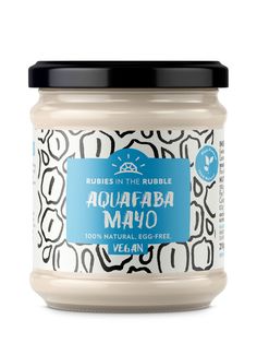 a jar of aquafaba mayo with black and white designs on the lid, in front of a white background