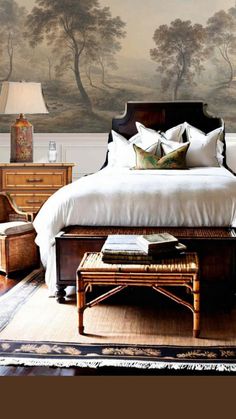 a bedroom with a large bed and two lamps on either side of the headboard