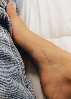 a person with a small tattoo on their foot that says, i love you so much