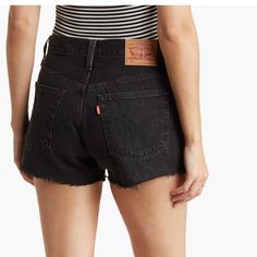 Levi's Women's 501 Original High-Rise Jean Shorts - Lunar Black 25. Never Worn, Original Tags Intact In Pristine Condition. A High Rise Offsets The Short Fit Of These Cutoff Denim Shorts With Distressed Details. 9" Rise, 2" Inseam Concealed Button Fly 5-Pocket Construction Distressed Details Raw Hem 100% Cotton Black Short Bottoms For Spring, Black Cutoff Shorts For Spring, Fitted Black Jeans With Short Leg, Spring Black Cutoff Shorts, Casual Black Cutoff Bottoms, Levi's Fitted Black Bottoms, Levi's Black Bottoms For Spring, Levi's High Waist Black Jean Shorts, Levi's Black Bottoms With Pockets