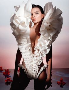 a woman with very large white ruffles on her body