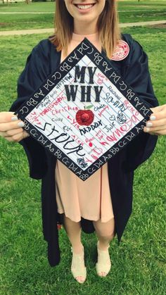 a woman is holding up her graduation cap with writing all over it and the words i'm wh on it