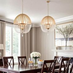 a dining room table with chairs and chandelier