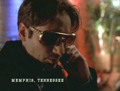 a man in sunglasses talking on a cell phone with the caption memphis tennessee