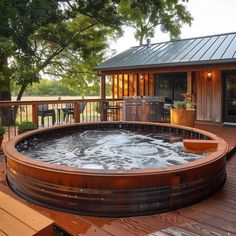 a hot tub sitting on top of a wooden deck